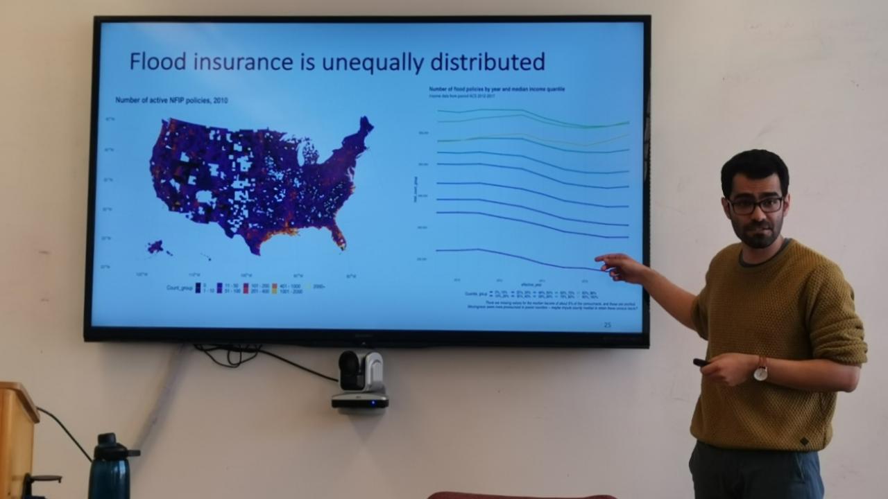 Jo is talking about the unequal distribution of flood insurance.