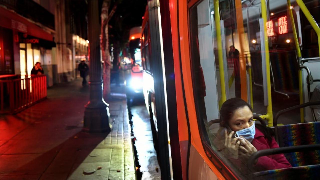 A passenger wears a mask on a Metro bus during the coronavirus outbreak in downtown Los Angeles.(Wally Skalij / Los Angeles Times)